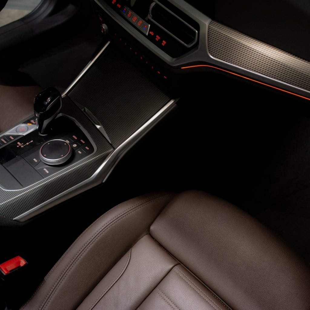 Detailer working on a car interior